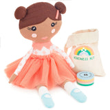 Little World Changers™ Muñeca niña rosa "Reparte Amabilidad", 12"